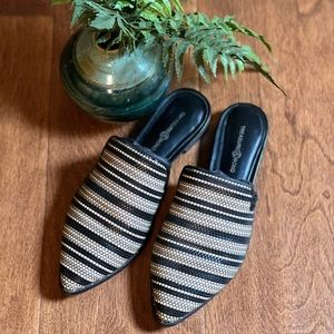 Woman’s Black and Tan and white slip on mules.